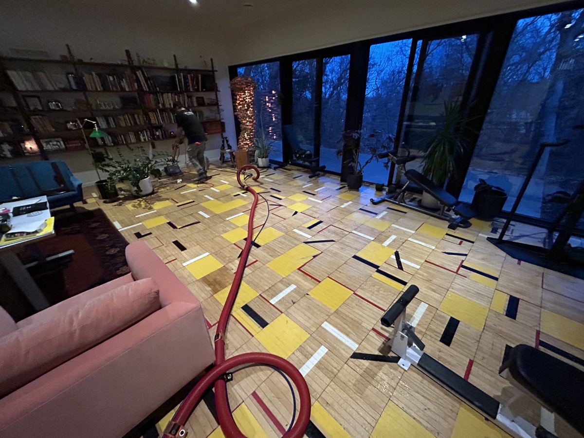 Hardwood floor cleaning near a staircase